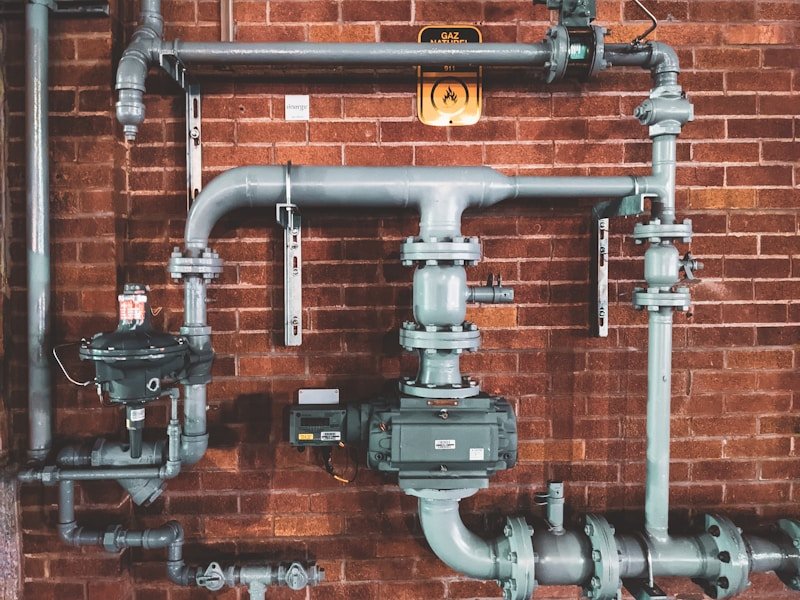 Plumber installing pipework on a new build