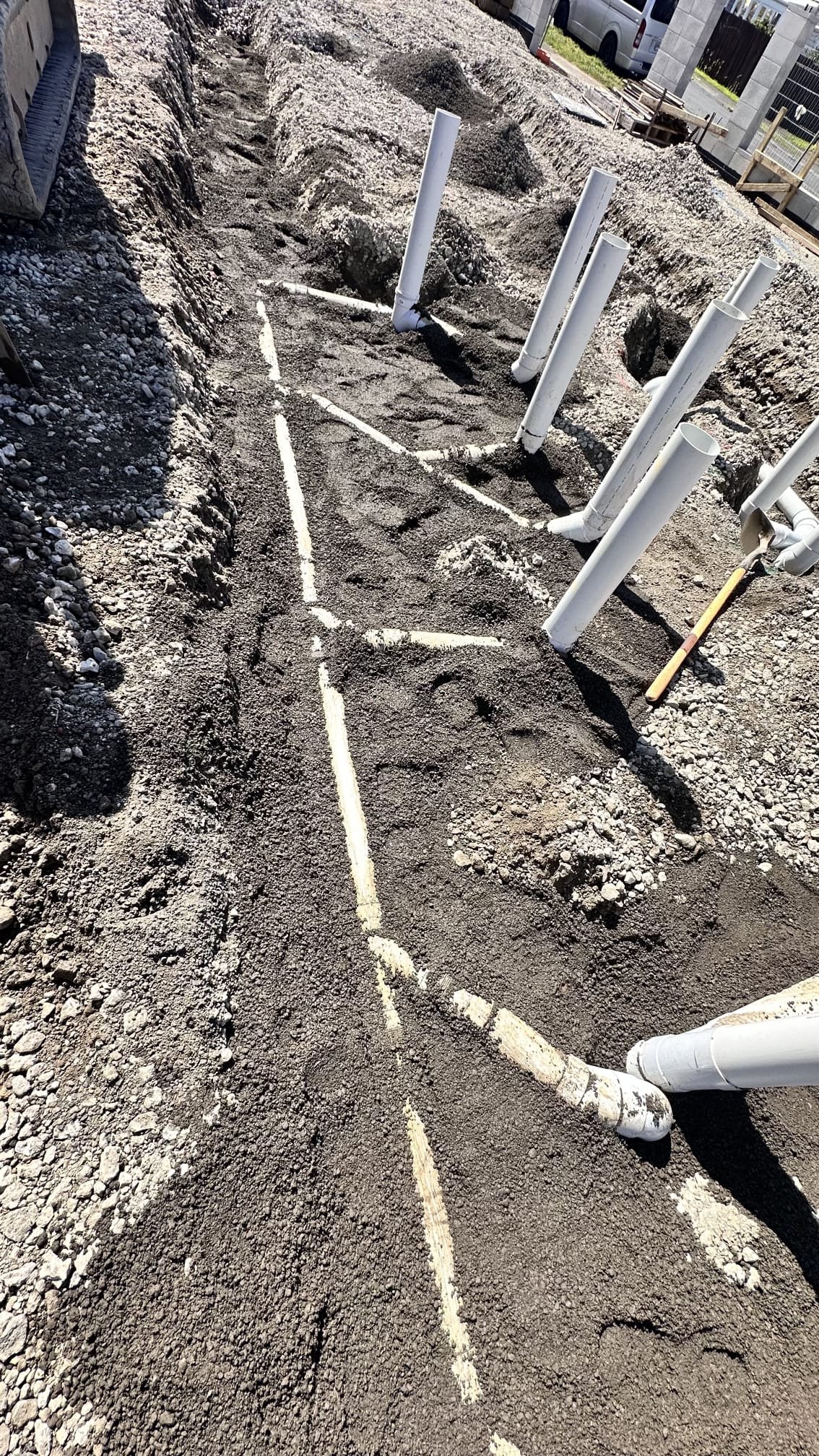 Backfilled drainage trench ready for reinstatement