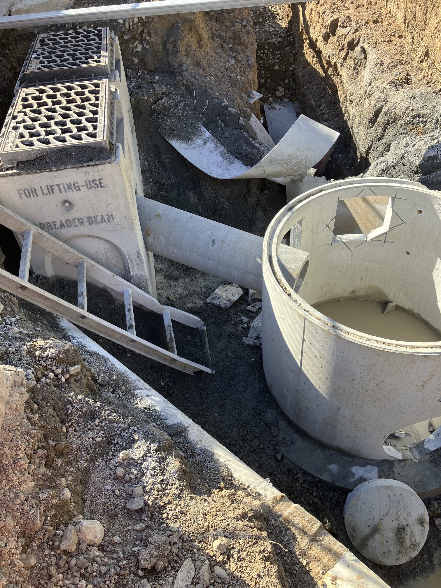 Public catch pit construction and kerb connection