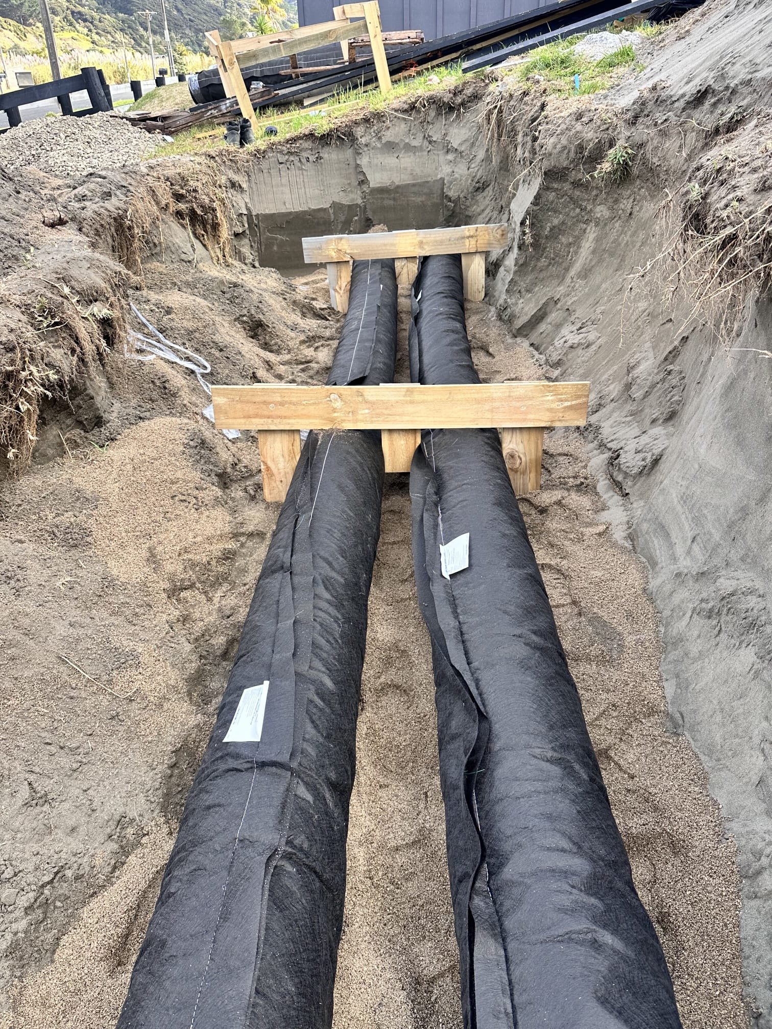 Sewer pipework installation with graded trench